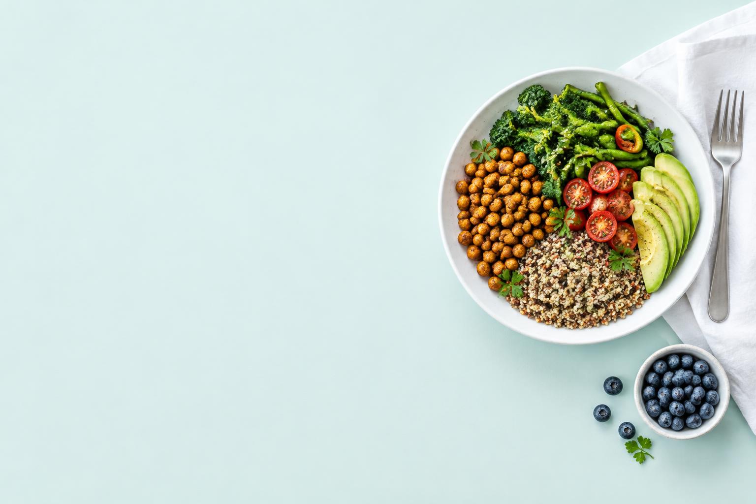 A fresh plate of chickpeas, quinoa, avocado and vegetables